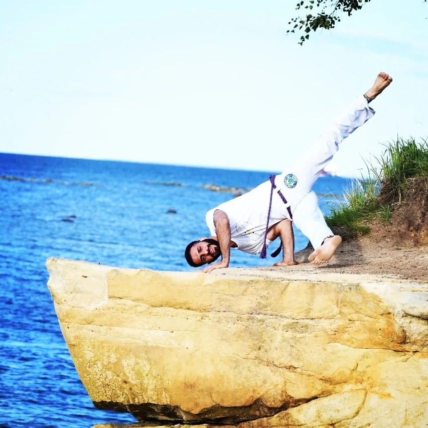 Capoeira movement by the sea