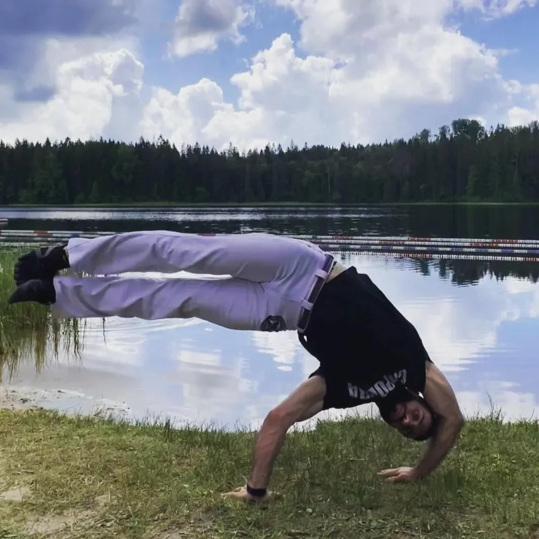 Acrobatic capoeira movement outdoors